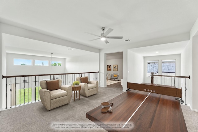 living room with carpet and ceiling fan