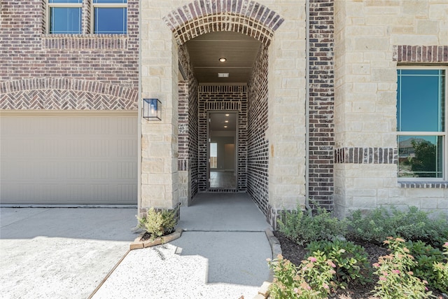 property entrance with a garage