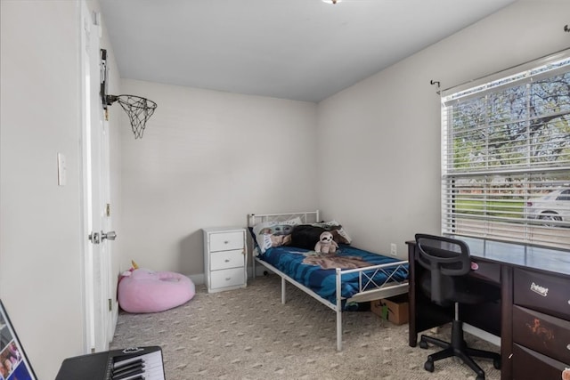 bedroom featuring light colored carpet