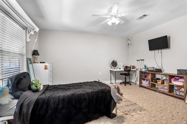 carpeted bedroom with ceiling fan