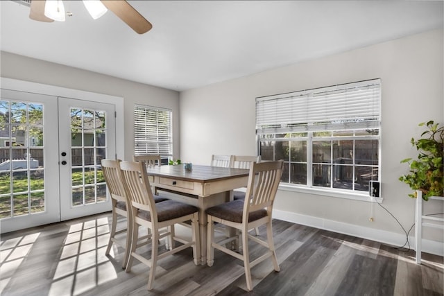 dining room featuring ceiling fan, dark wood-type flooring, and french doors