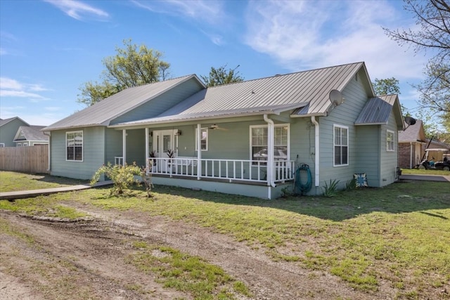 ranch-style home featuring a front yard and covered porch