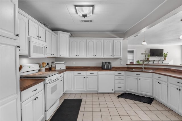 kitchen with white cabinetry, light tile floors, pendant lighting, white appliances, and sink