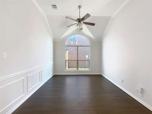 unfurnished room with dark hardwood / wood-style floors, ceiling fan, vaulted ceiling, and ornamental molding