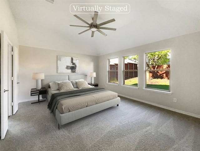 carpeted bedroom featuring ceiling fan and vaulted ceiling