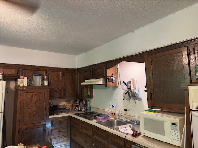 interior space featuring a textured ceiling, ceiling fan, and light tile floors