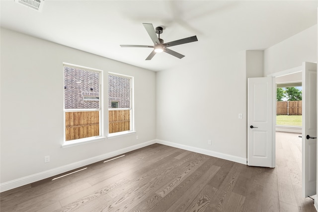 empty room featuring ceiling fan and dark hardwood / wood-style floors