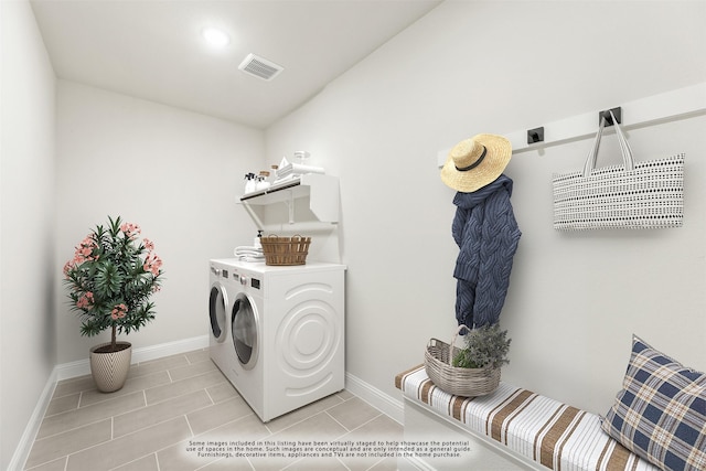 laundry area featuring light tile patterned flooring and independent washer and dryer