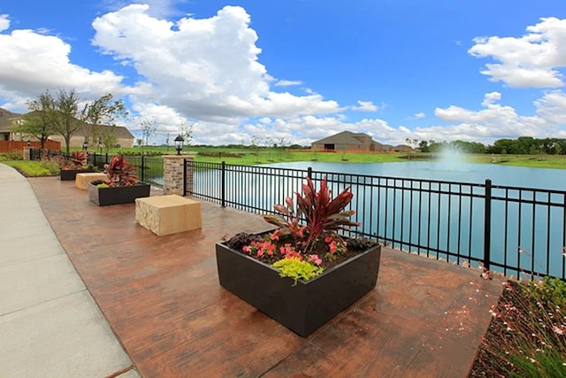 view of terrace featuring a water view