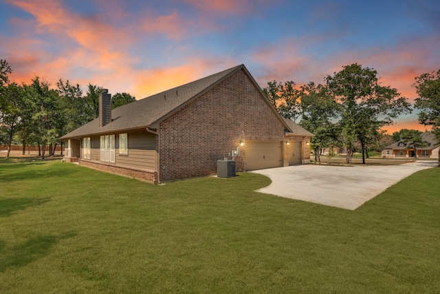 property exterior at dusk with central air condition unit and a lawn