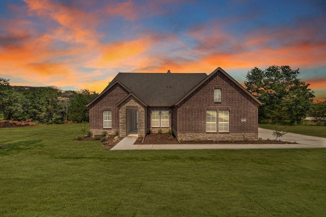 view of front of house with a lawn