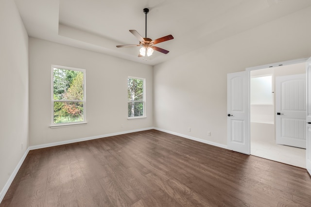 unfurnished room with ceiling fan and wood-type flooring