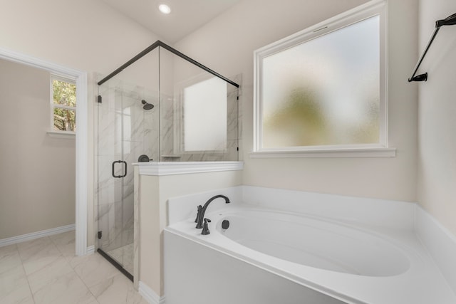 bathroom with separate shower and tub and tile patterned flooring