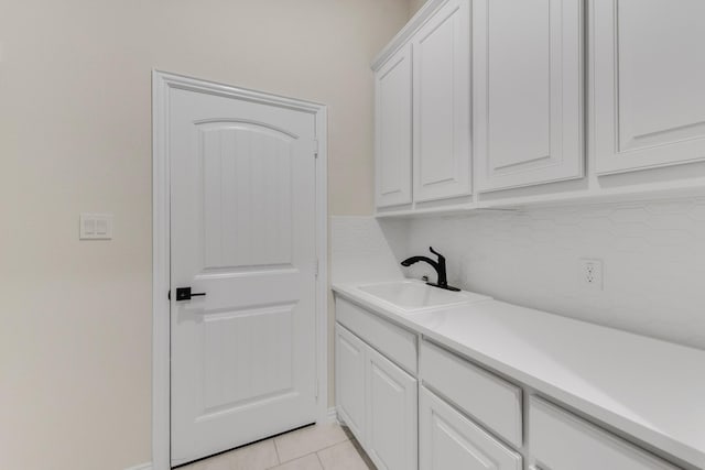 washroom with sink and light tile patterned floors