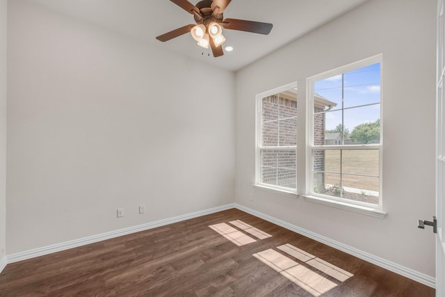 unfurnished room with dark hardwood / wood-style floors and ceiling fan