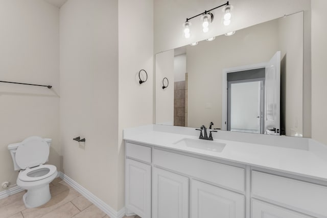 bathroom with tile patterned floors, toilet, and vanity