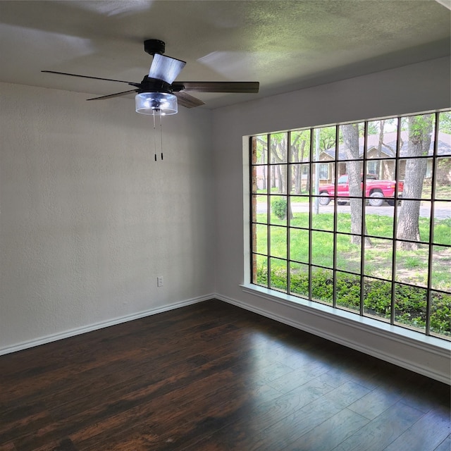 unfurnished room featuring ceiling fan and hardwood / wood-style flooring