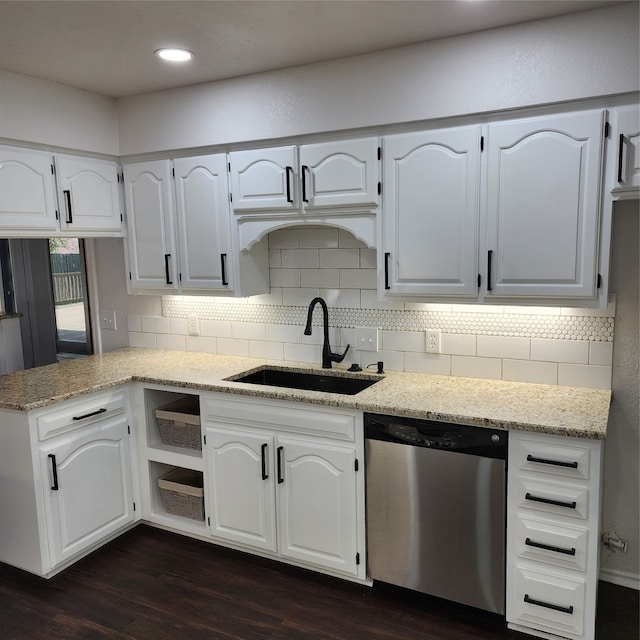 kitchen featuring white cabinets, sink, dark hardwood / wood-style flooring, and dishwasher