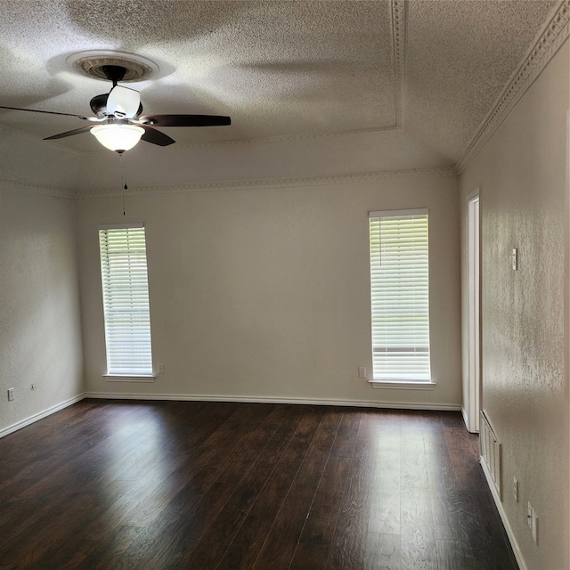 spare room with ceiling fan, hardwood / wood-style floors, ornamental molding, and a healthy amount of sunlight