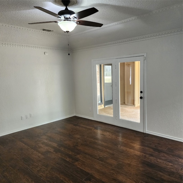 empty room featuring a textured ceiling, ceiling fan, hardwood / wood-style flooring, and french doors