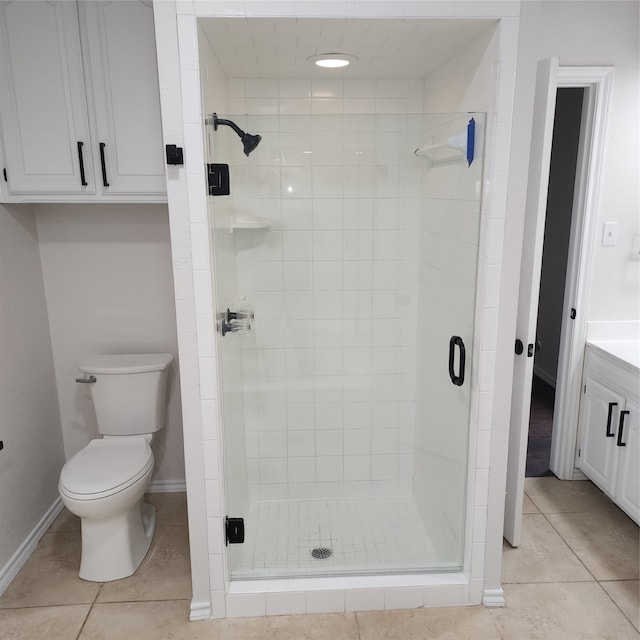 bathroom with a shower with shower door, tile patterned flooring, and vanity