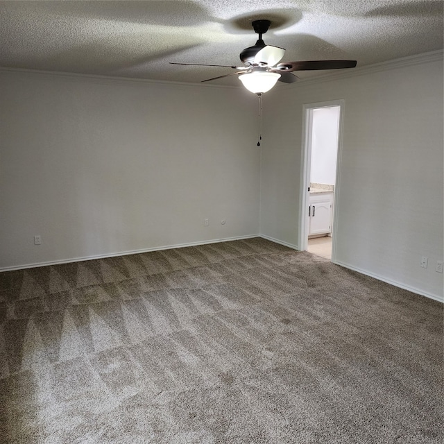 empty room featuring ceiling fan, a textured ceiling, and carpet