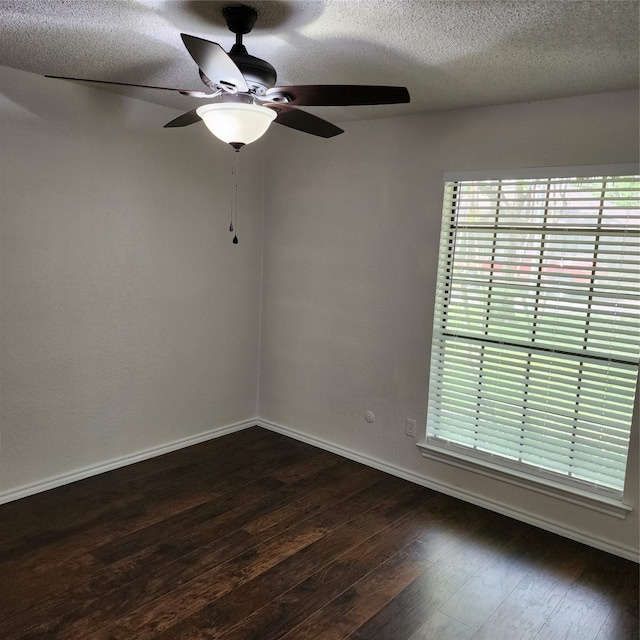 spare room featuring ceiling fan, a textured ceiling, and wood-type flooring