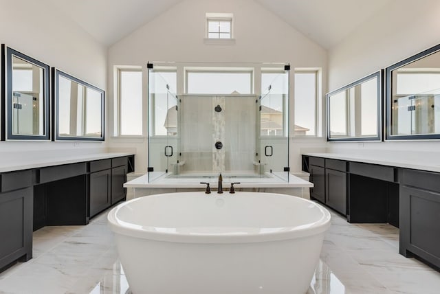 bathroom with vanity, high vaulted ceiling, and separate shower and tub