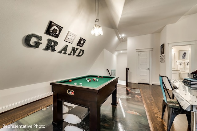 game room featuring dark hardwood / wood-style floors, an inviting chandelier, and lofted ceiling