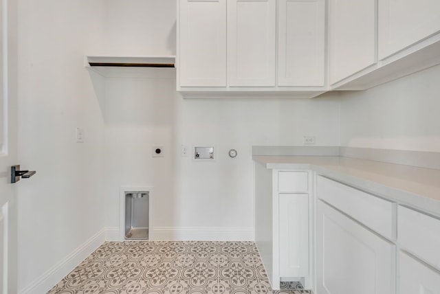 clothes washing area featuring washer hookup, electric dryer hookup, cabinets, and gas dryer hookup