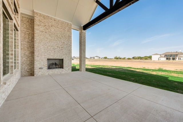 view of patio / terrace with a large fireplace