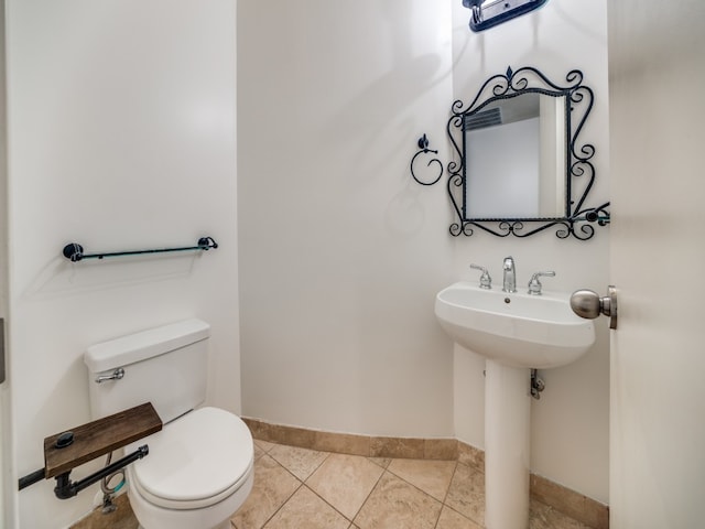 bathroom with tile patterned flooring and toilet