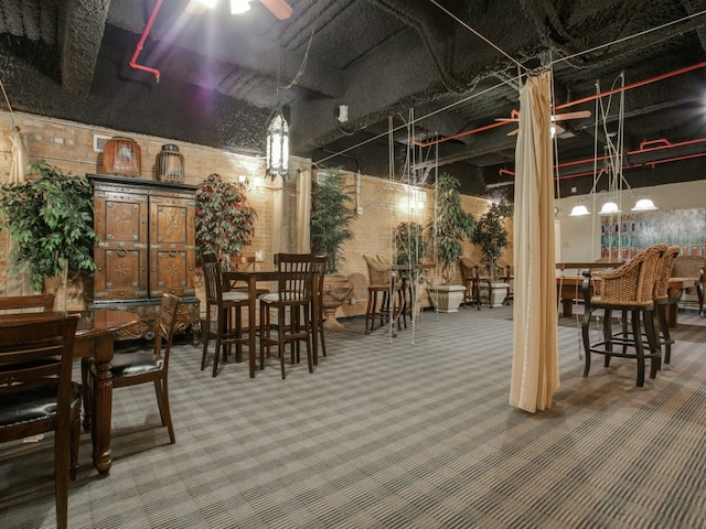 dining room with ceiling fan and carpet floors