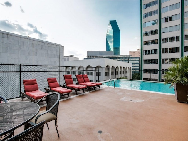 community pool with a patio