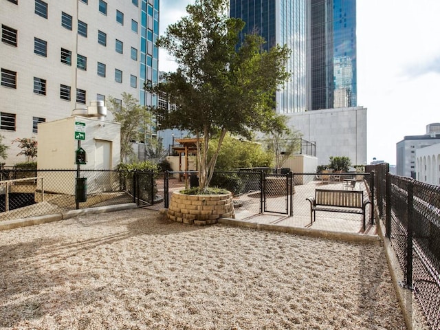 surrounding community with a gate and fence