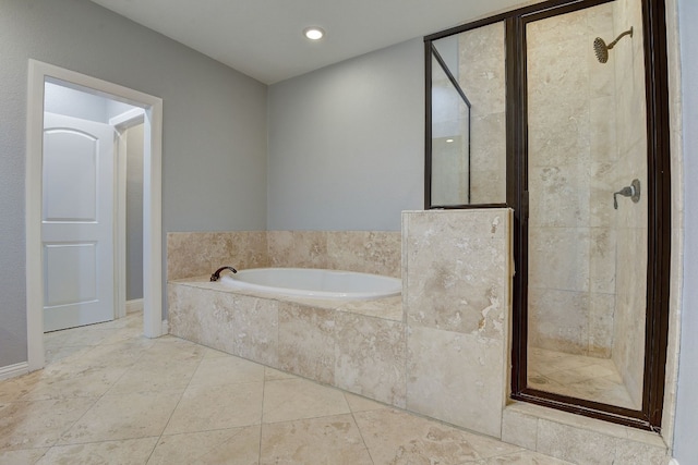 unfurnished bedroom with light colored carpet, ceiling fan, and ensuite bathroom