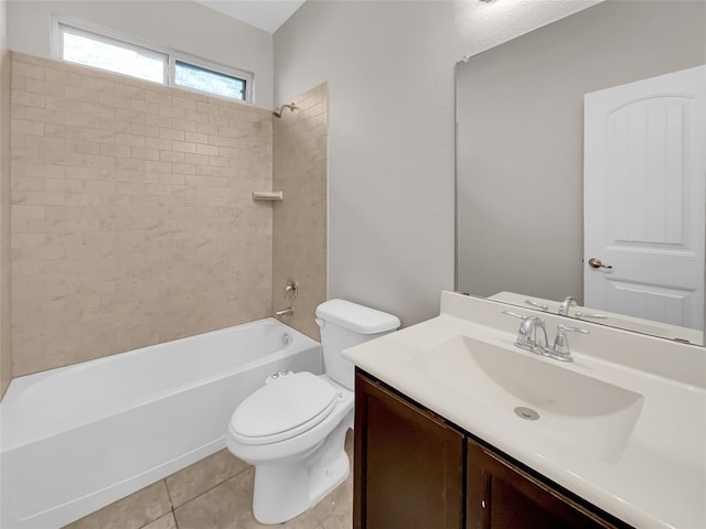 full bathroom featuring tile floors, toilet, vanity, and tiled shower / bath