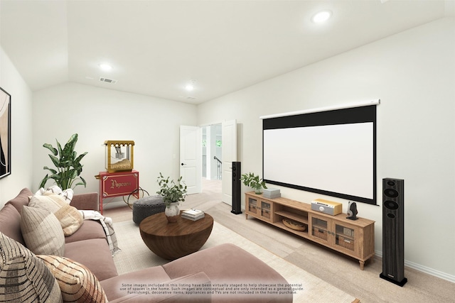 cinema room featuring light carpet, visible vents, baseboards, lofted ceiling, and recessed lighting