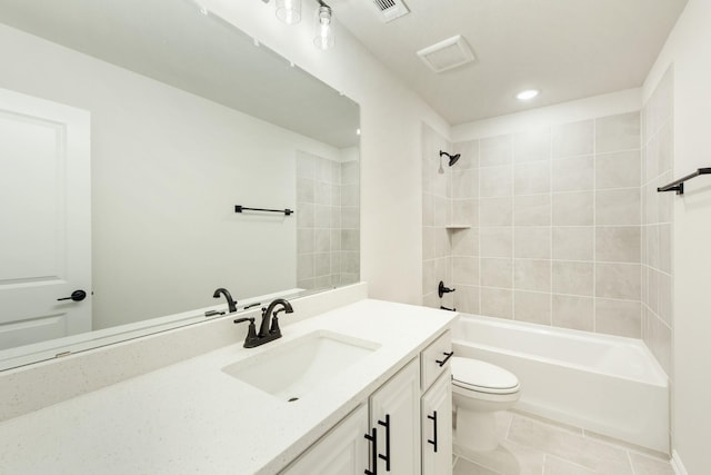 bathroom with bathtub / shower combination, visible vents, toilet, vanity, and tile patterned flooring