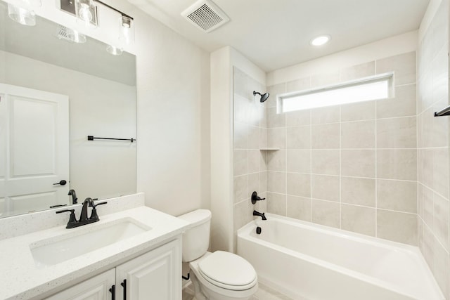 bathroom with toilet, shower / bath combination, vanity, and visible vents