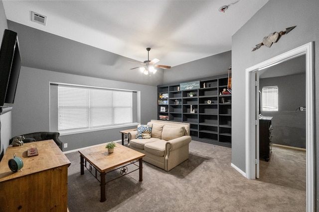 carpeted living room with plenty of natural light and ceiling fan