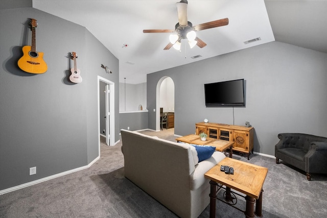 living room featuring ceiling fan, lofted ceiling, and carpet floors