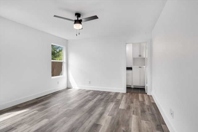 unfurnished room with wood-type flooring and ceiling fan