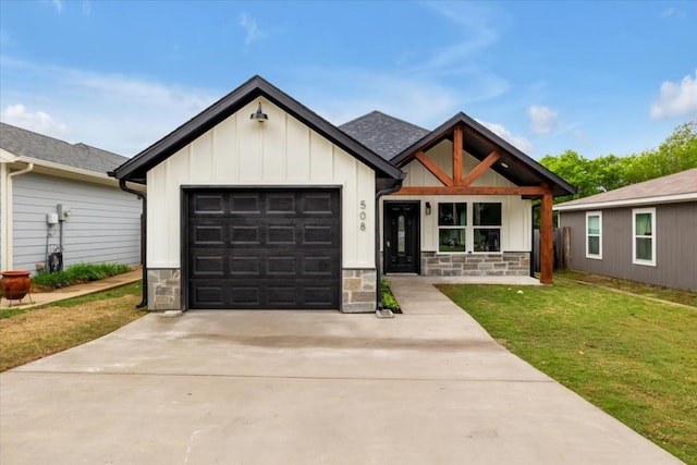 modern inspired farmhouse featuring a garage and a front lawn