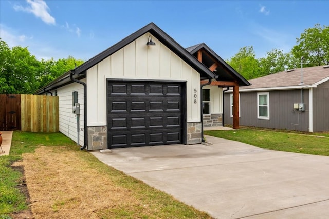 modern farmhouse style home with a garage and a front lawn