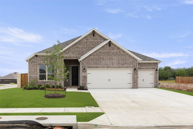 craftsman-style home featuring a front yard and a garage