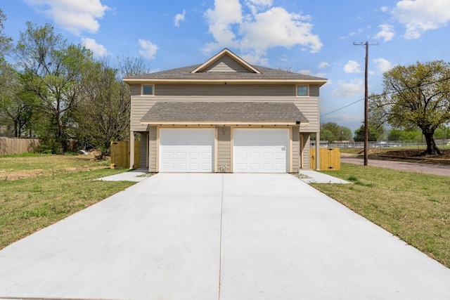 view of front of property with a garage and a front lawn