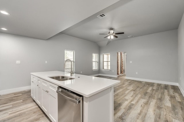 kitchen featuring stainless steel dishwasher, ceiling fan, light hardwood / wood-style floors, sink, and a center island with sink