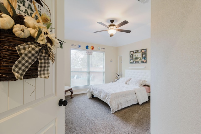 carpeted bedroom featuring ceiling fan