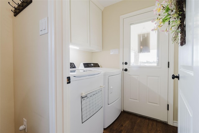 laundry room with cabinets, separate washer and dryer, and dark wood-type flooring